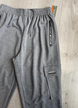 Спортивні штани на манжеті трикотаж із накладними кишенями карго5 фото