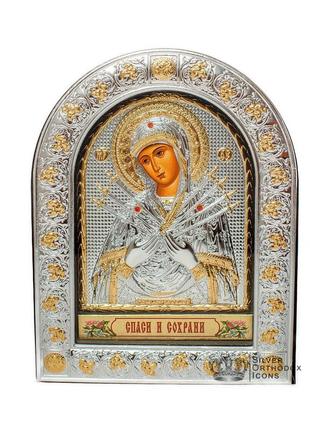 Семистрільна 12х15,5 см срібна ікона божої матері під склом, обгорнута в темну шкіру (греція)1 фото
