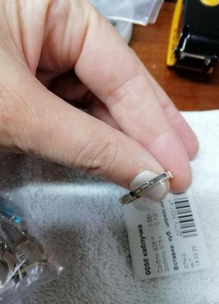 Каблучка срібна із золотими вставками та одним білим цирконом тонка