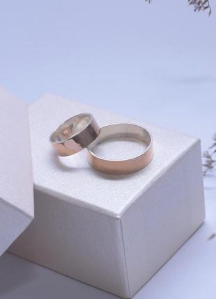 Обручальные кольца серебряные с золотой напайкой американки1 фото