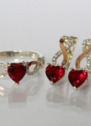 Набор из серебра и золота с белыми фианитами и красными фианитами в форме сердца5 фото