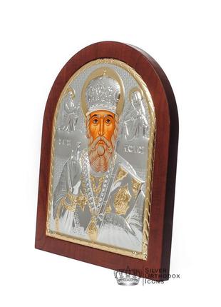 Серебряная икона николая чудотворца 8,1х9,7см арочной формы на дереве