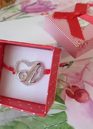 Браслет зі срібною буквою а з червоною ниткою та білими фіанітами