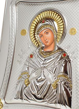 Серебряная икона семистрельная божья матерь 20х25см в серебренной рамке украшена позолотой4 фото