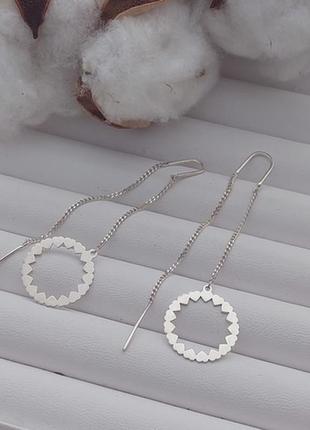 Сережки протяжки срібні з круглими підвісками сердечками