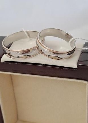 Обручальные кольца серебряные с золотыми напайками по краям пара4 фото