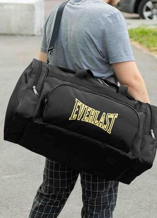 Спортивна чоловіча дорожня сумка everlast biz yellow чорна тканинна в поїздок на 60 літрів для екіпіровки і