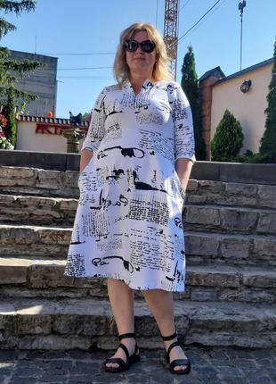Жіноча трикотажна повсякденна ділова біла сукня з чорним принтом у вигляді написів з кишенями великі розміри2 фото