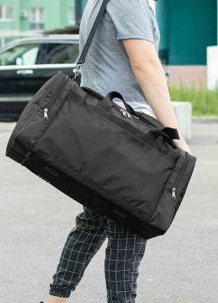 Велика дорожня спортивна сумка fat чорна тканинна для поїздок і тренувань у залі на 60 літрів міцна10 фото
