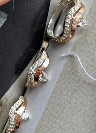 Комплект серебряный с золотом: кольцо и серьги с фианитами разных цветов7 фото