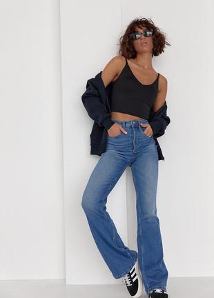 Жіночі джинси кльош з круглою кокеткою ззаду сині5 фото