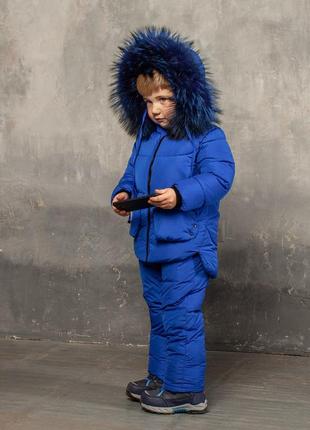 Дитячий зимовий костюм синього кольору з водовідштовхувальним плащової тканини