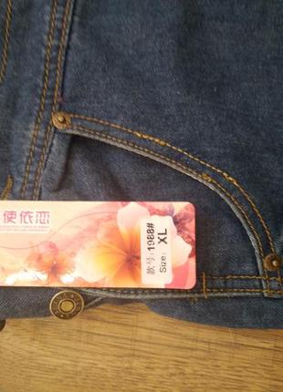 Легкий джинсовий комбінезон із потертостями.4 фото