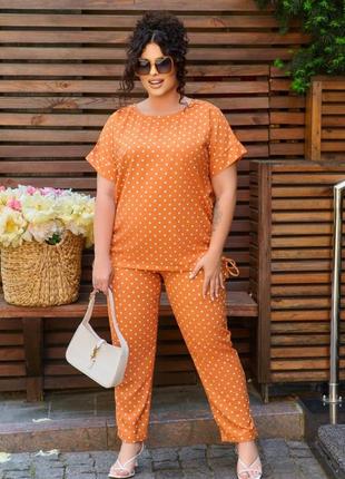 Костюм блузка свободная по бокам на затяжке вырез круглый рукав короткий брюки прямые на резинке с карманами низ подворот ткань софт вискозный