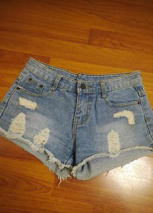 Блакитні джинсові шорти рвані зістарені короткі жіночі шортики котонові з потертостями бахромою1 фото
