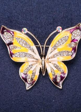 Брошка метелик білі стрази фіолетова, жовта емаль 42х56мм жовтий метал