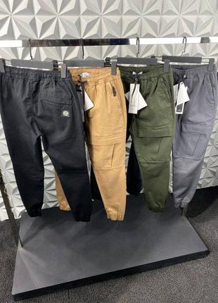 Брендовые брюки в стиле stone island стон айленд премиум качественные люкс карго с боковыми карманами1 фото