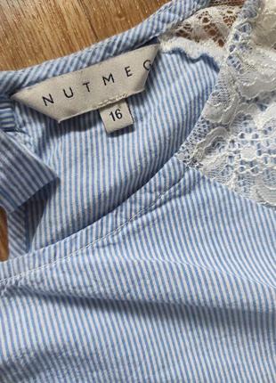 Изысканная свободная блуза с кружевом в мелкую полоску с завязками на спине и укороченными рукавами6 фото