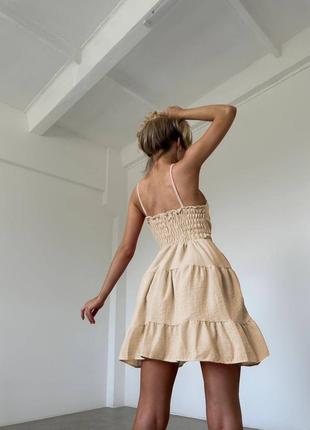 Шикарное льняное короткое платье мини беби долл с пышной юбкой расклешенное с корсетным лифом декольте на бретельках белое розовое молочное бежевое2 фото