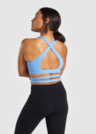 Новый спортивный топ gymshark poise wrap around bralette - malibu blue - s3 фото