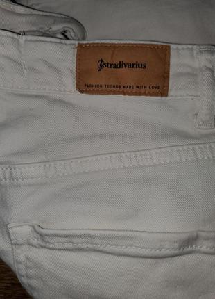 Кремові джинси stradivarius кльош із розрізами7 фото