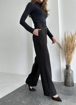 Стильные женские брюки палаццо с широкими штанинами черного цвета классические штаны на высокой посадке4 фото