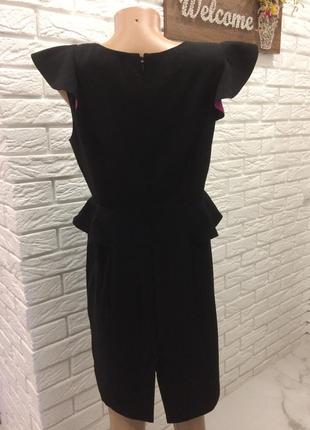 Чорне плаття міні з рюшами і баскою.5 фото