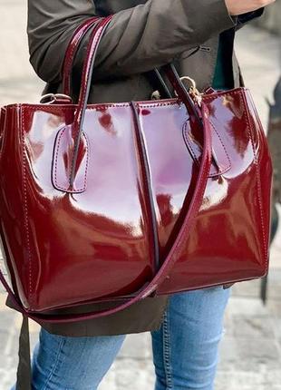 Женская кожаная сумочка цвета марсала1 фото