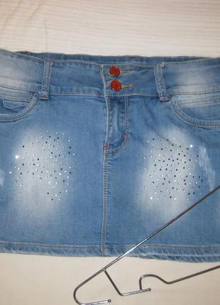 Коротка сексі джинсова спідниця з стразами та потертистями км1741 з кишенями2 фото