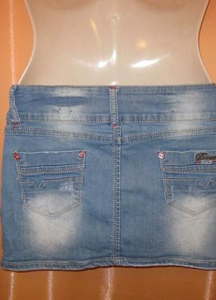 Коротка сексі джинсова спідниця з стразами та потертистями км1741 з кишенями4 фото