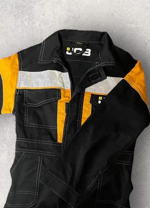 Джинсовый комбинезон jcb 6-7 лет.2 фото