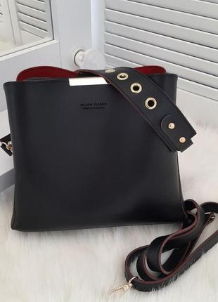 Женская модная черная с красным сумочка  екокожа.2 фото