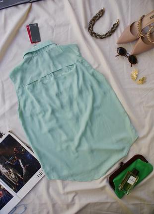 Актуальная трендовая удлиненная блуза мята с декором шипами7 фото