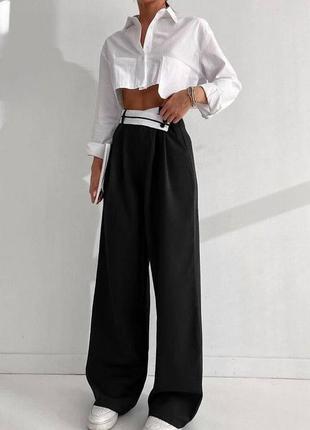 Стильні жіночі штани палаццо із широкими штанинами чорного кольору класичні штани на високій посадці