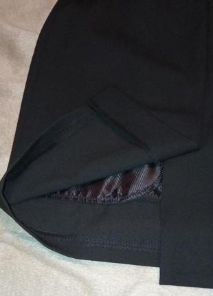 Черная юбка карандаш, украшенная бантиком4 фото