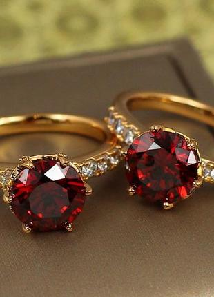 Кольцо  xuping jewelry праздник жизни с красным камнем р 19 золотистое