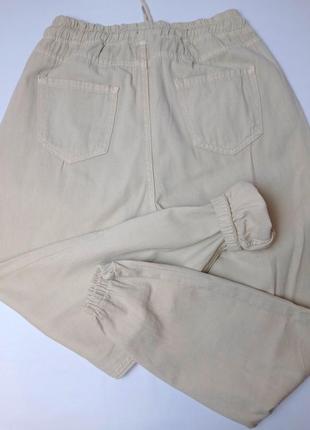 Женские штаны летние джогеры на резинке молочного цвета8 фото