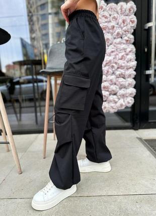 Трендові штани карго з кишенями знизу регулюються резинками брюки стильні чорні хакі сірі