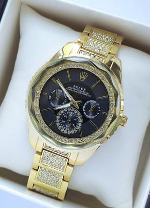 Жіночий годинник золотого кольору з чорним циферблатом