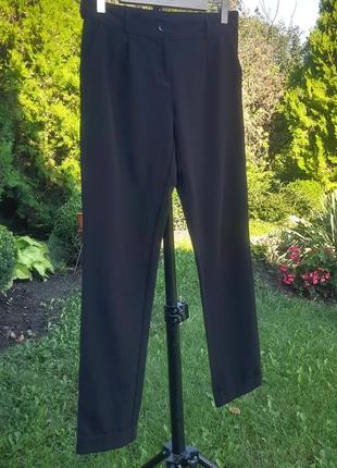 Черные зауженные брюки с боковыми карманами3 фото