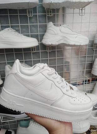 Кросівки шкіряні білі nike air force4 фото