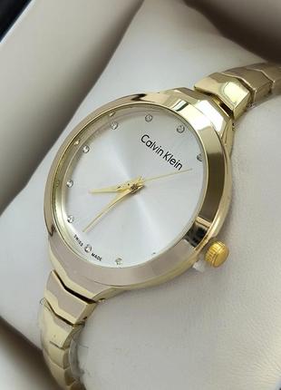 Жіночий наручний годинник на тонкому браслеті золотого кольору  із сріблястим циферблатом3 фото