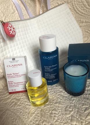 Подарочный набор clarins spa relax,косметичка,масло для тела,средство душа и аромасвеча2 фото