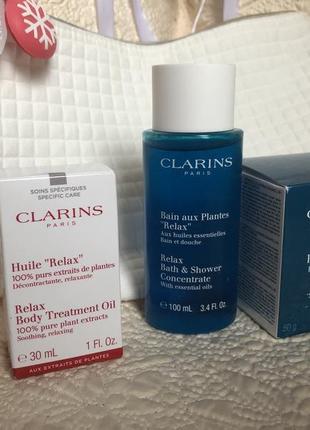 Подарочный набор clarins spa relax,косметичка,масло для тела,средство душа и аромасвеча4 фото