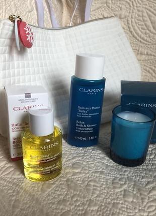 Подарочный набор clarins spa relax,косметичка,масло для тела,средство душа и аромасвеча5 фото