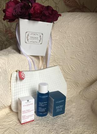 Подарочный набор clarins spa relax,косметичка,масло для тела,средство душа и аромасвеча6 фото