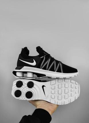 Снікерси кросівки nike shox gravity чорно білі платформа стержні з пустими місцями