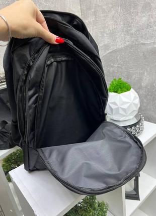 Черный практичный стильный вместительный рюкзак со светоотражателем5 фото