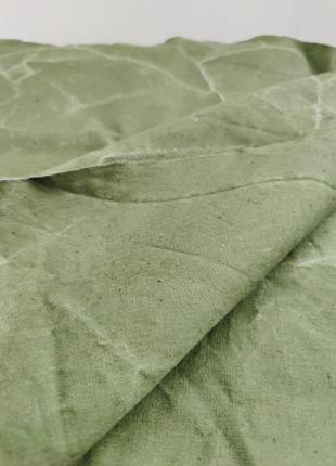 Плотная ткань зеленого цвета