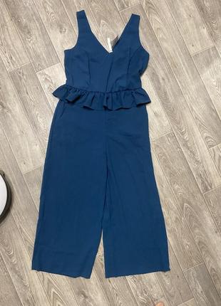 Стильный ромпер комбинезон изумрудного цвета с баской